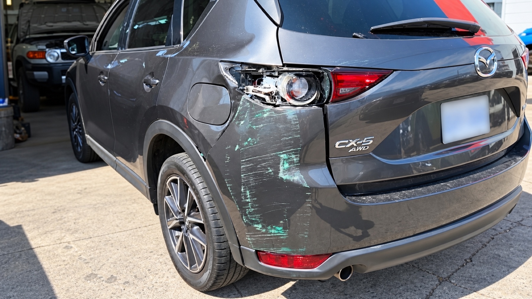 Mazda CX-5 with left rear collision damage before repair at Advanced Autoworks