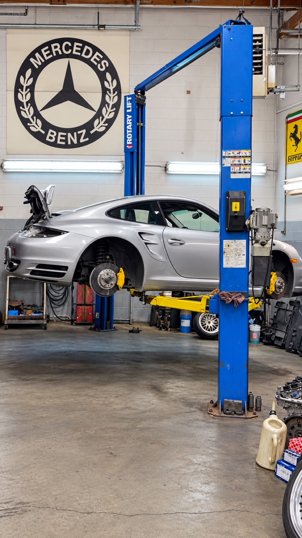 Brake service in progress on a vehicle raised on a lift