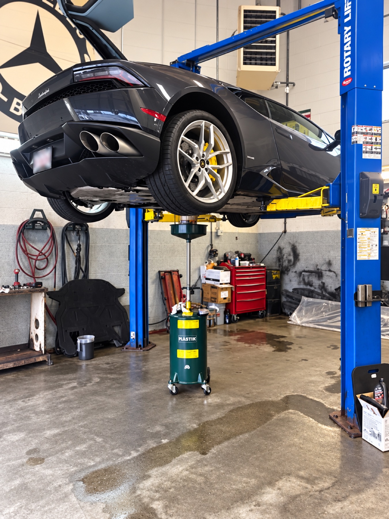Mechanical service being performed underneath a vehicle