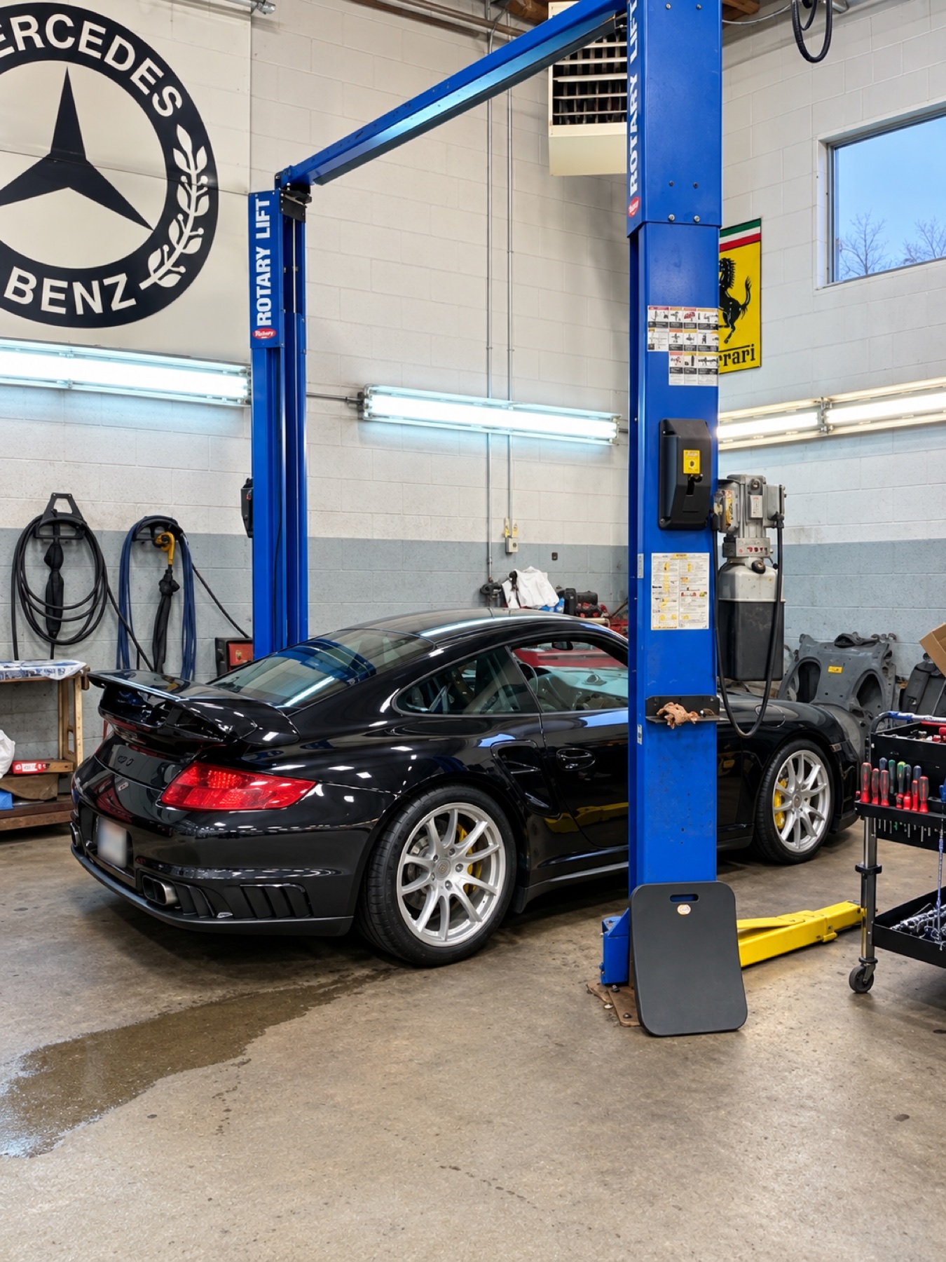 Vehicle being serviced in an Advanced Autoworks repair bay